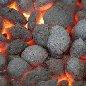 Hot charcoal briquettes, ready for food to be grilled over.