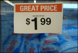 Sign showing the price of 10 pounds of packaged ice at a grocery store.