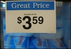 Sign showing the price of 20 pounds of packaged ice at a grocery store.