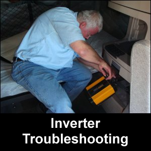 Mike Simons installing an inverter in the cabinet behind the driver's seat in a Freightliner Cascadia. This is where inverter troubleshooting first took place.