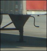 A close-up of the dropped dry van's landing gear sticking out.