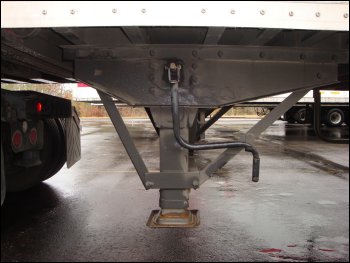 The correct position of the landing gear crank handle behind a fixed hook.