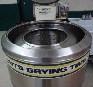 The Bock centrifuge spins clothes at a high speed to pull more water out of washed clothes so that they dry faster in the dryer. It cuts drying time.