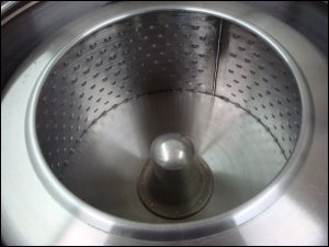 The basket of the Bock centrifuge into which washed clothes are placed for removing more water prior to drying. It cuts drying time.