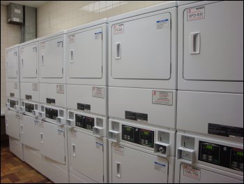 A row of coin-operated stack dryers in a truckstop.