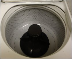 The basket of a Maytag coin operated washing machine.