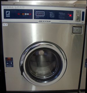 A Dexter Mega Load washing machine, which requires 20 quarters to operate and can wash 55 pounds of dry clothing.