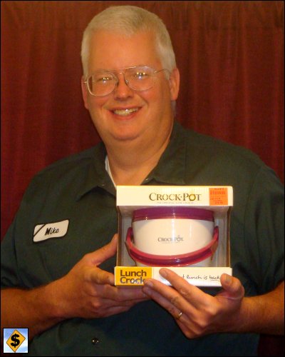 Professional truck driver Mike Simons holds the Lunch Crock, to show how small this crock pot is.