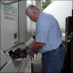 Mike Simons putting diesel fuel into the company tractor he drove regionally.