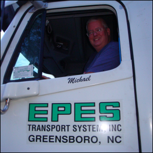 Mike Simons shown sitting in a truck he once drove professionally.