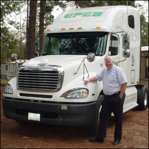 Mike standing near a truck he drove for Epes Transport.