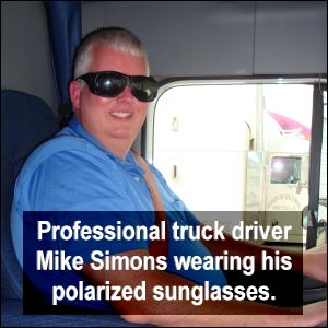 Professional truck driver Mike Simons wears his polarized sun glasses in his truck.