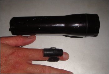 Comparing the size of a standard flashlight powered by 2 D-cells and the Nighthawk Ultralight.