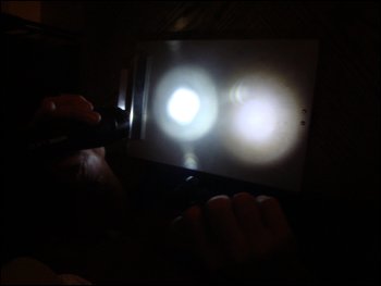 Comparing the light from our 5 LED light flashlight with the light from a Nighthawk Ultralight.