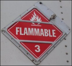 A flammable placard on the front of a trailer.