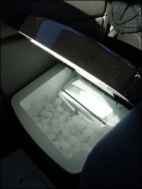 Portable ice machine on the floor in front of the passenger seat makes would-be thief entry through the peek window hard if not impossible.
