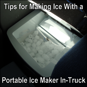 NewAir AI200-SS portable ice machine in a Freightliner Cascadia between the dash and passenger seat.