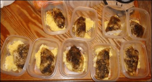 Chicken and rice in small plastic containers.