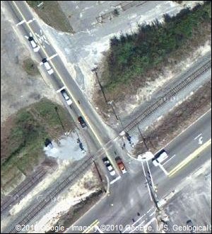 Google satellite image of close-up of an intersection in Aiken County, SC, with a railroad crossing.