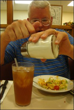 Mike had to tap the sugar dispenser to get the sugar to flow into his glass of tea at the Country Pride Restaurant at the Willington Travel Center in Willington, CT.