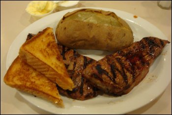 This was Vicki's menu selection from the Country Pride Restaurant at the Willington Travel Center in Willington, CT: two steaks (one of which she got 'to go'), a baked potato with butter and sour cream on the side, and Texas toast.