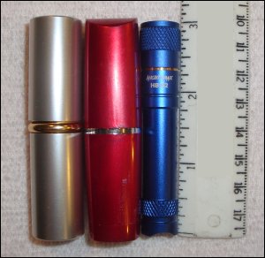 Comparing the size of the Bantam HB 62 to a ruler and two lipsticks.