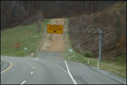 Runaway truck ramp or escape ramp off steep grade.