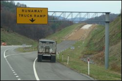 Runaway truck ramp or escape ramp off steep grade.