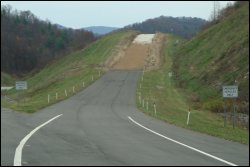 Runaway truck ramp or escape ramp off steep grade.