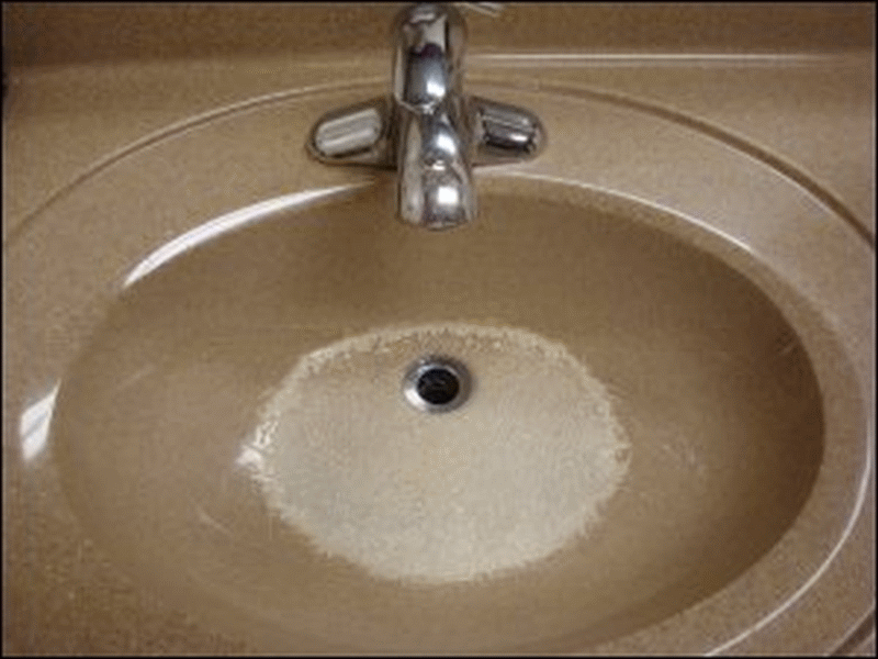 This shower room at the Pilot in Priceville, AL, has a sink bowl with a badly marred surface and a missing drain plug or stopper.