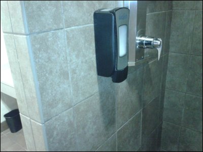 View of shower control and soap dispenser in shower at Pilot in Inver Grove Heights, MN