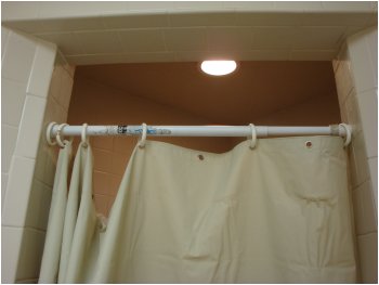 The shower curtain in Shower #4 of the Pilot at Florence, SC, was too wide for the entrance to the shower stall and had only 5 rings to hold up the curtain with 12 hanging holes.