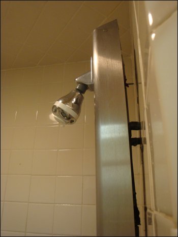 The shower head assembly in Shower #4 at the Pilot in Florence, SC, had already started coming loose from the shower stall wall.