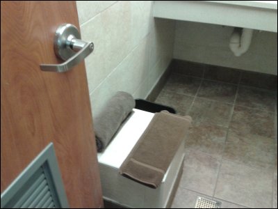 View of seat, towel and cloth bath mat in shower at Pilot Travel Center east of Knoxville, TN