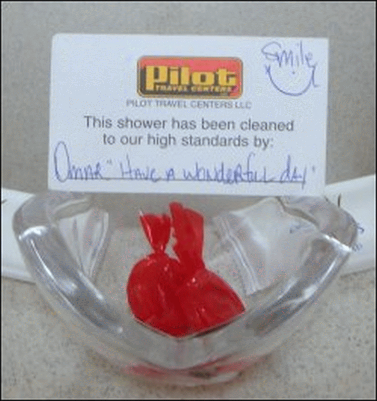 The candy dish with two pieces of candy and personalized card from the janitor, Omar, at the Pilot Travel Center in Nitro, WV.