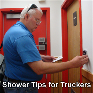 Shower Tips for Truckers. Professional truck driver Mike Simons enters the code to enter a shower at a truck stop facility.