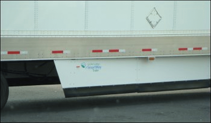 Close-up of side skirt air fairing on semi tractor trailer.