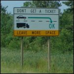 A sign that reads 'Don't Get a Ticket – Leave More Space'