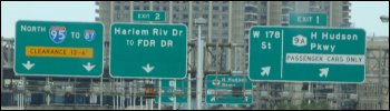 Road sign showing Exit 1 in New York City, the parkway part of which is for cars only.