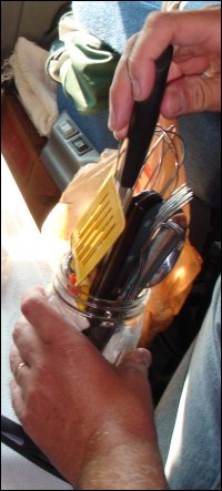 Cooking and eating utensils being stored in a truck.