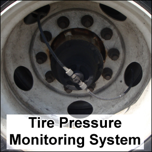 A tire pressure monitoring system installed on a trailer tire rim.