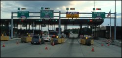 A toll plaza with ticket and EZ Pass lanes.