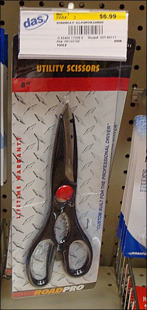 A pair of utility scissors bearing on the package the RoadPro® name, for sale at $6.99 at a national chain truck stop.