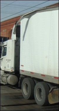 Roof damage on the front of a trailer.