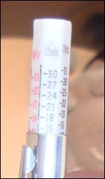 Tread depth gauge showing millimeters and inches as expressed in 32nds.