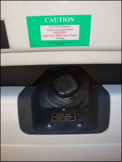 The opening to a fuel tank on a Freightliner Cascadia.