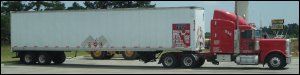 Side view of an 18-wheel tractor trailer