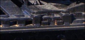 Close up view of a fifth wheel platform in which the pins are placed in the most rearward positions.