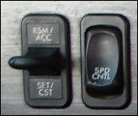 Truck cruise control switches in a Freightliner Cascadia.