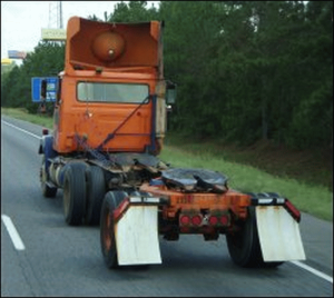A daycab tractor pulls a converter gear that connects double or triple trailers.